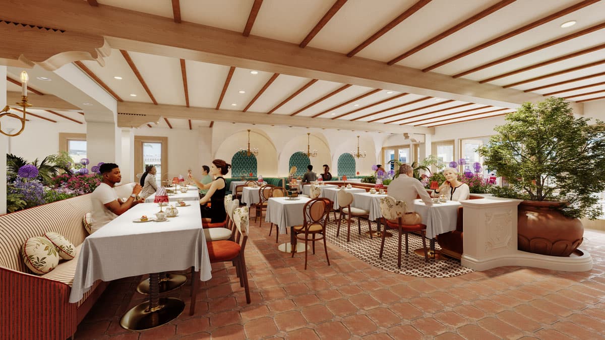 Elegant restaurant with wooden beams, terracotta floors, and patrons dining at tables with white tablecloths.